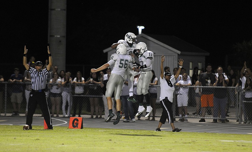 The Lakewood Ranch High offense celebrates Cameron Pearceyâ€™s 46-yard touchdown catch in the first quarter.