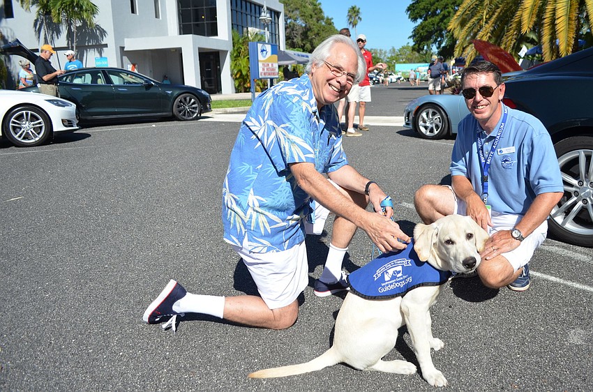 Dick Singer with Soethby, a guide dog puppy in training, and Nigel Mould