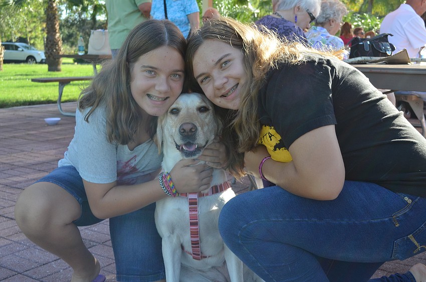 Sisters Allison and Margaret Stewart with their dog, Tiana