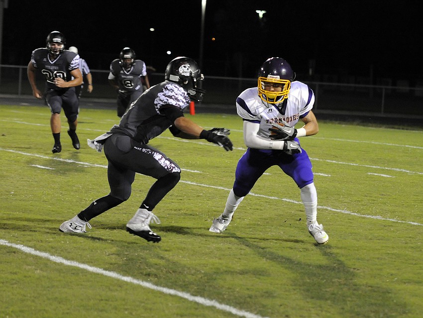 Booker senior George Swain returns a punt in the second half.