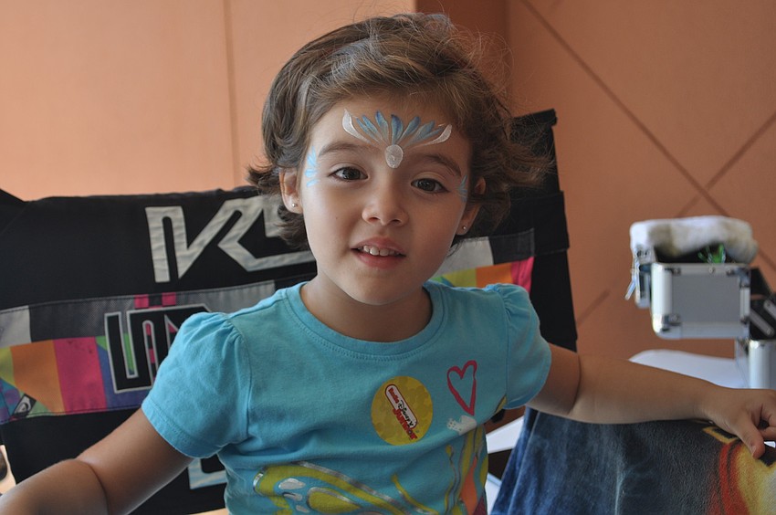 Cecilia Briceno gets her face painted