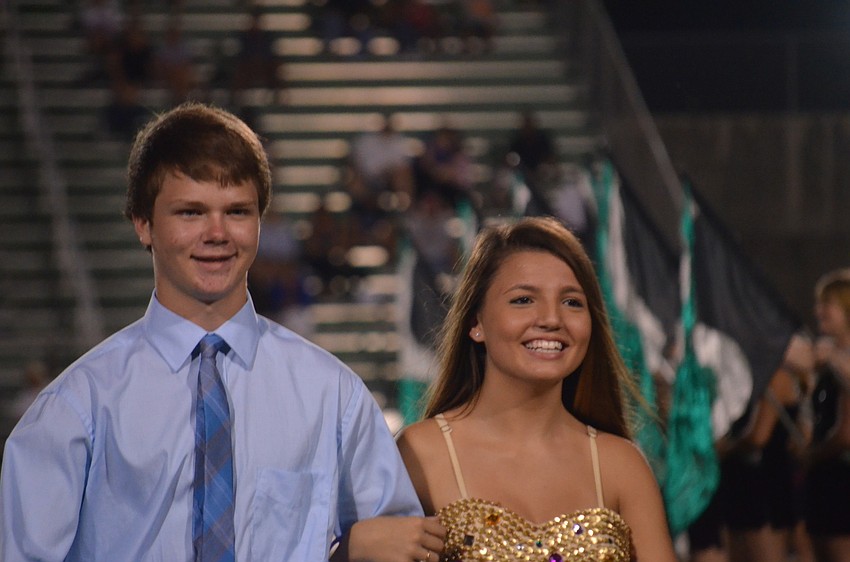 Aaron Cota, 15, escorts Sienna Cirringione, 15, during half time.