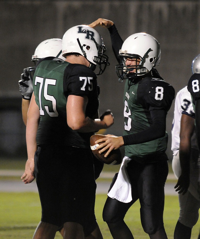 Quarterback Chad Rex celebrates following his 1-yard touchdown run at the start of the second quarter.