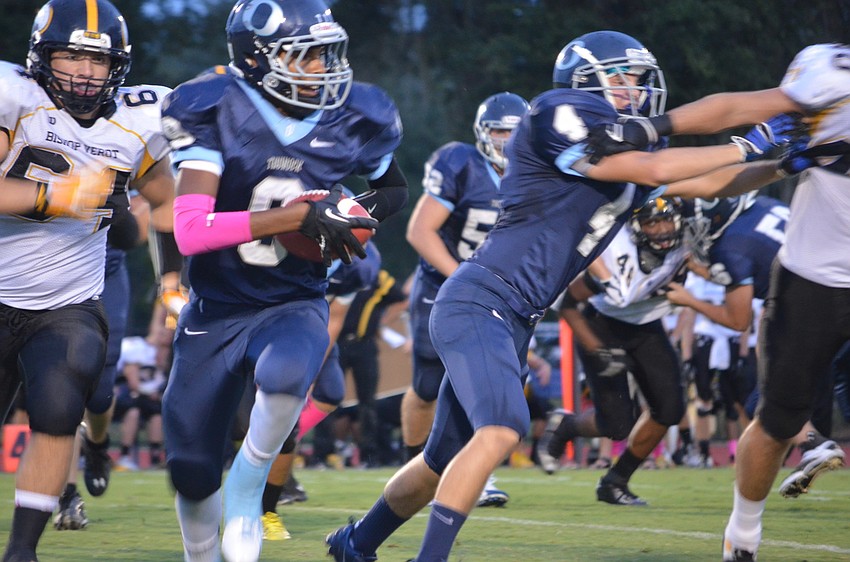 Wide receiver and defensive back David Grain tries to make it to the next down.