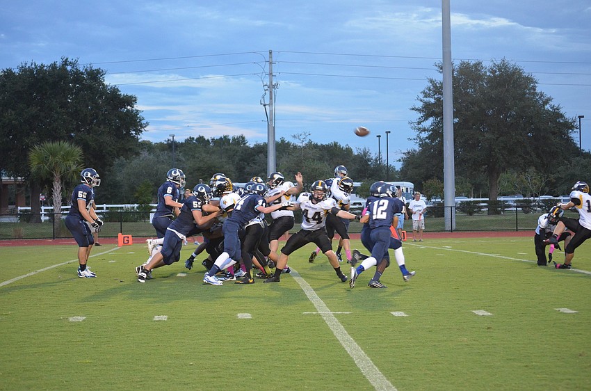 Bishop Verot holds back ODA as they kick a field goal.