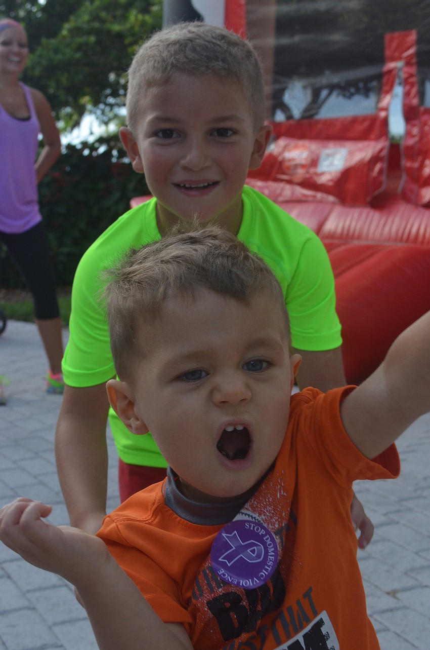Wyatt Alday, 6, and his stepbrother L.J. Owens, 1, play together Saturday morning.