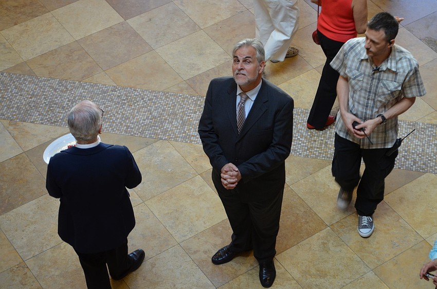 Maestro Victor DeRenzi greets patrons in the lobby