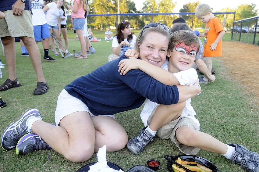 Sara Popovich and her son Alex, 6, attended the family picnic before the game.
