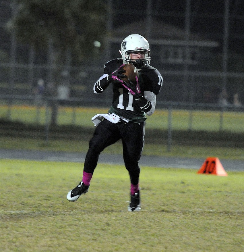 Justin Fischer carries the ball for a 19-yard gain.