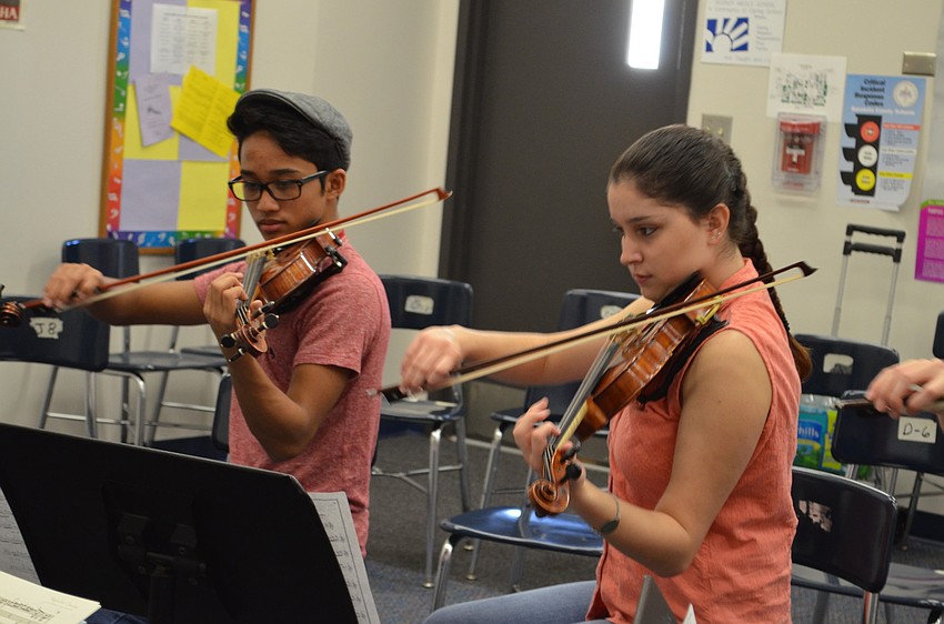 Reonel Rafols, 15, attends Lakewood Ranch High School; Emily Champagne, 17, attends Braden River High School