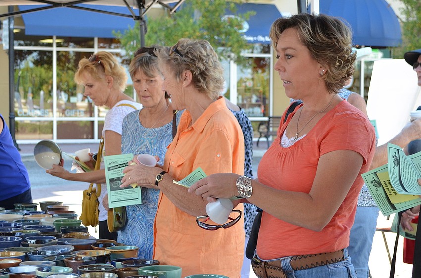 Guests choose from a variety of hand crafted ceramic bowls.