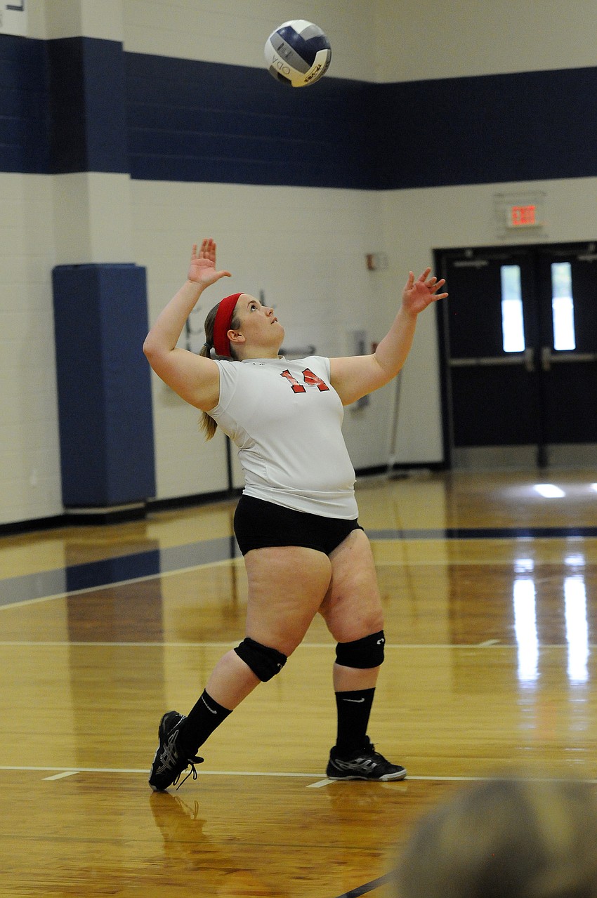 Cardinal Mooney setter Lexi Barbour serves the ball during the first set.