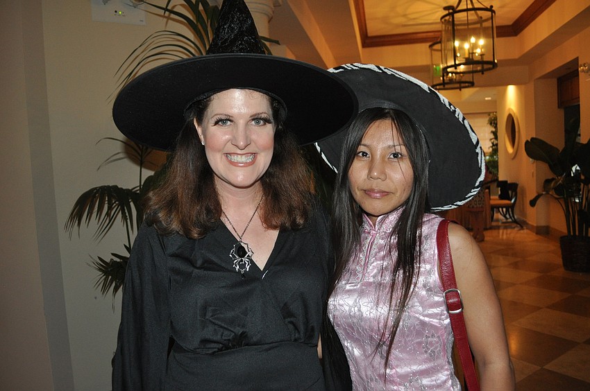 Rebecca Dalton of the Lakewood Ranch Information Center and Qi Li of Keller Williams