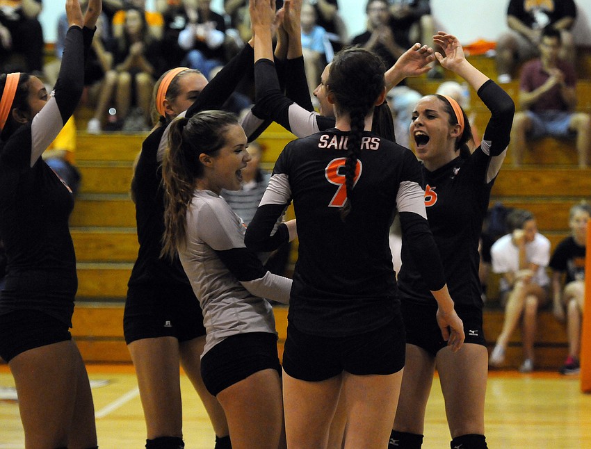 The Sarasota High volleyball team celebrates a point during its 3-1 Class 7A-District 10 semifinal victory over Braden River Oct. 22.