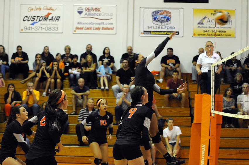 Sophomore Desiree Leiding sends the ball back over the net to Braden River.