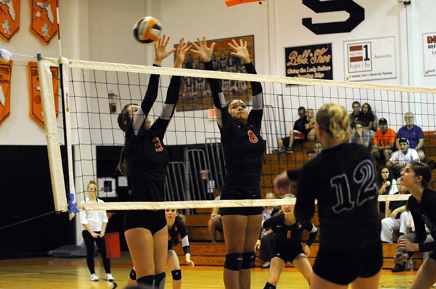 CeCe Knight and Desiree Leiding go up for a block in the second set.