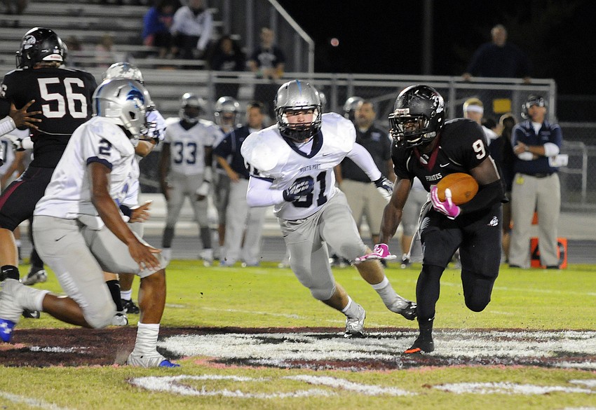 Braden River running back Titus Humphrey picks up a first down on the Pirates opening possession.