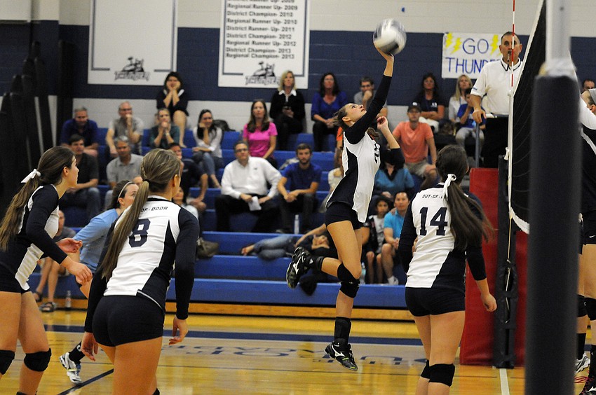 Outside hitter Lauren Maxey sends the ball back over the net to Calvary Christian.