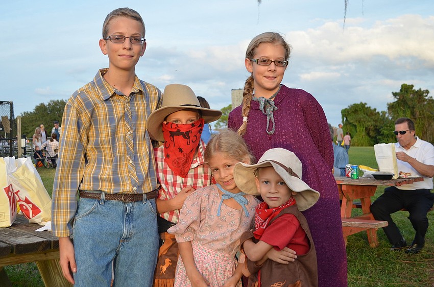 Caleb, Cole, Leah, Lindsey and Calvin Canna all dressed to the â€˜Wild West Festâ€™ theme of Tabernacleâ€™s Night of Light Family Fall Fest.