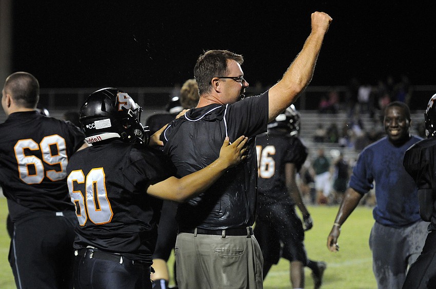 Sarasota High coach Ed Volz celebrates following his team's district championship victory over Lakewood Ranch.