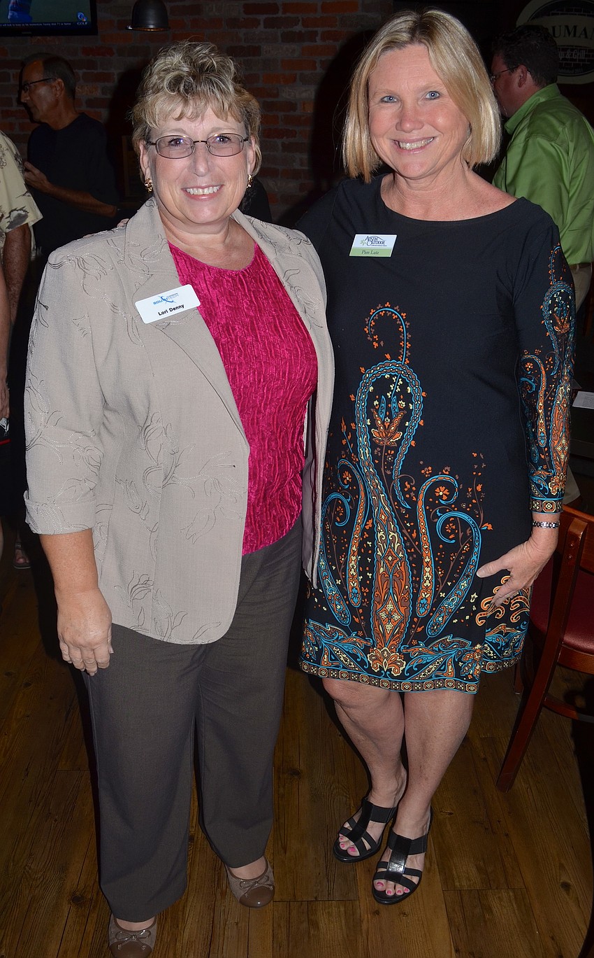 Lori Denny and Pam Lutz share laughs together.