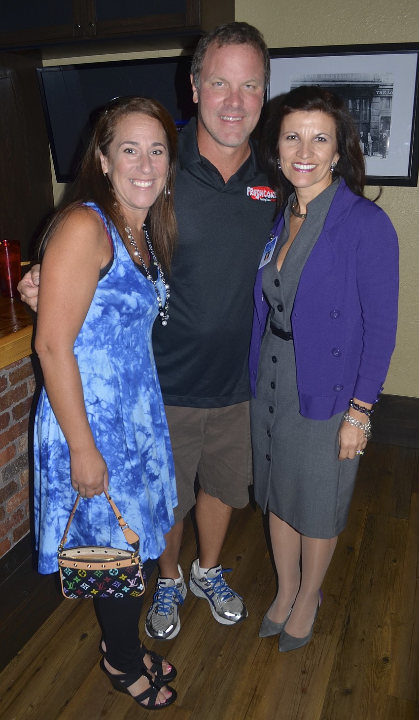 Alli and Bob Taraska joke around with Violeta Huesman.