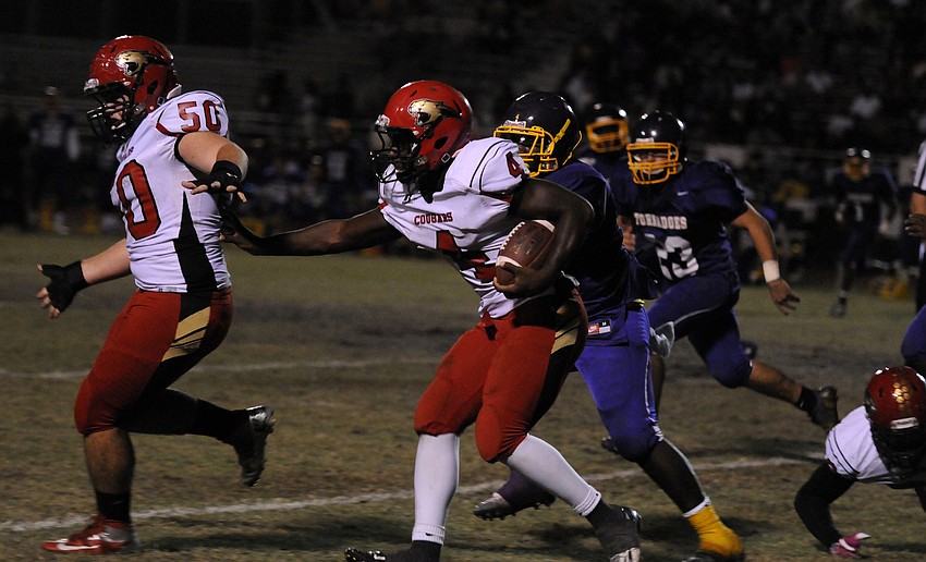 Demardre Patterson follows offensive lineman Sam McMullenâ€™s block for a first down in the second half.