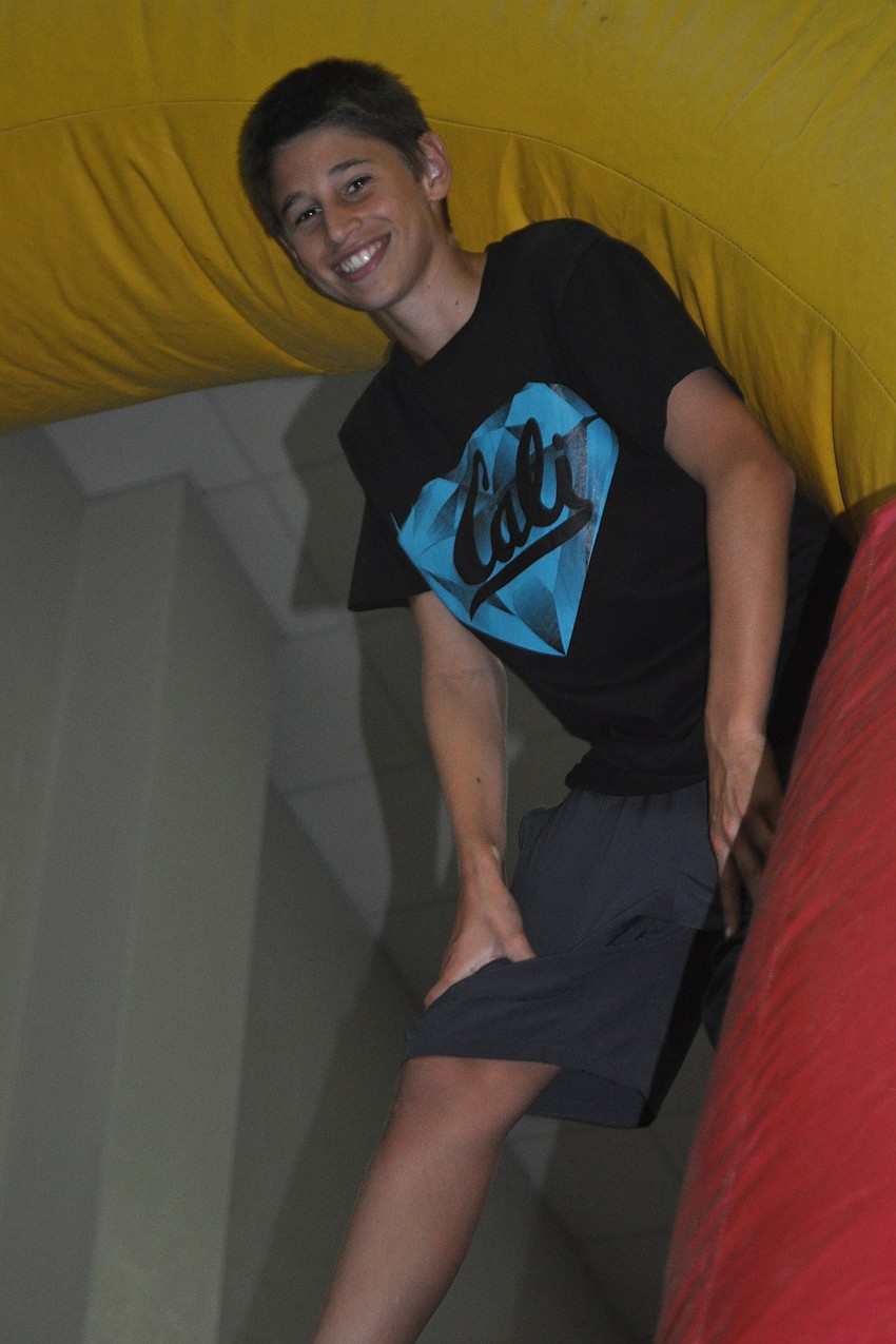 Trevor Gorji helped make sure children on the inflatable obstacle course stayed safe.