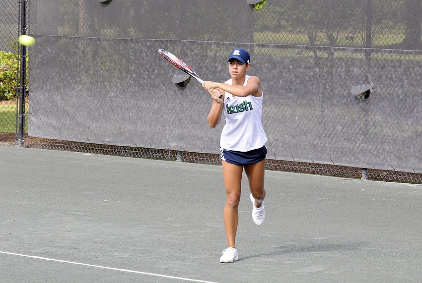 Notre Dame senior Britney Sanders sends the ball back over the net during her opening round singles match Nov. 8.