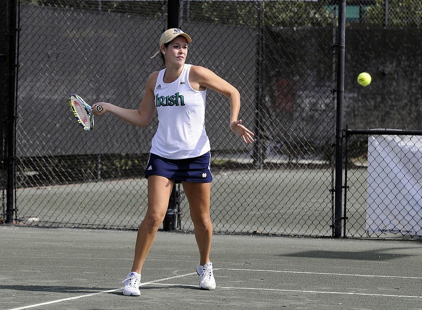 Notre Dame junior Molly Oâ€™Koniewski returns the ball back over the net.