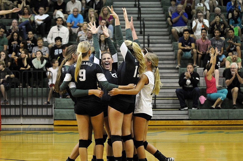 The Lakewood Ranch High volleyball team celebrates a point during its Class 7A-Region 3 final match versus Naples Gulf Coast Nov. 9.
