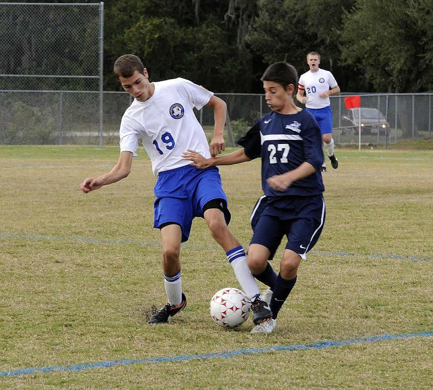 Sarasota Military Academyâ€™s Vincent Niglio-Parein and ODAâ€™s Trevor Gorji battle for possession in the first half.