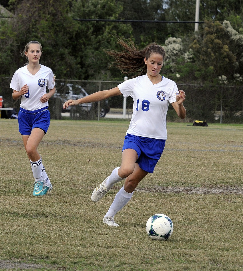 Sarasota Military Academyâ€™s Alyson Gable sends the ball back up the field.