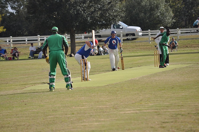 The Memorial Cricket Club (blue) squared up with the Cayman Islands (green).