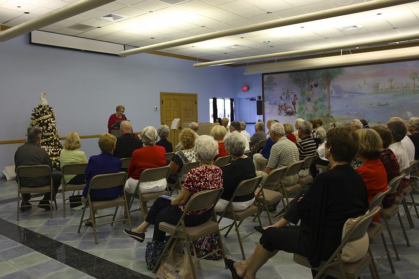 A large group of parishioners gathers for the Christmas concert.