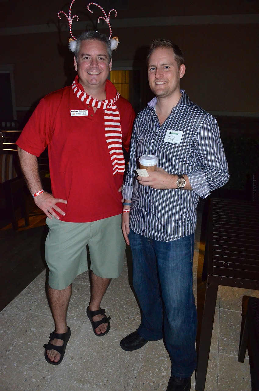 Matthew Anderson and Ted Smoot ring in the holiday season.