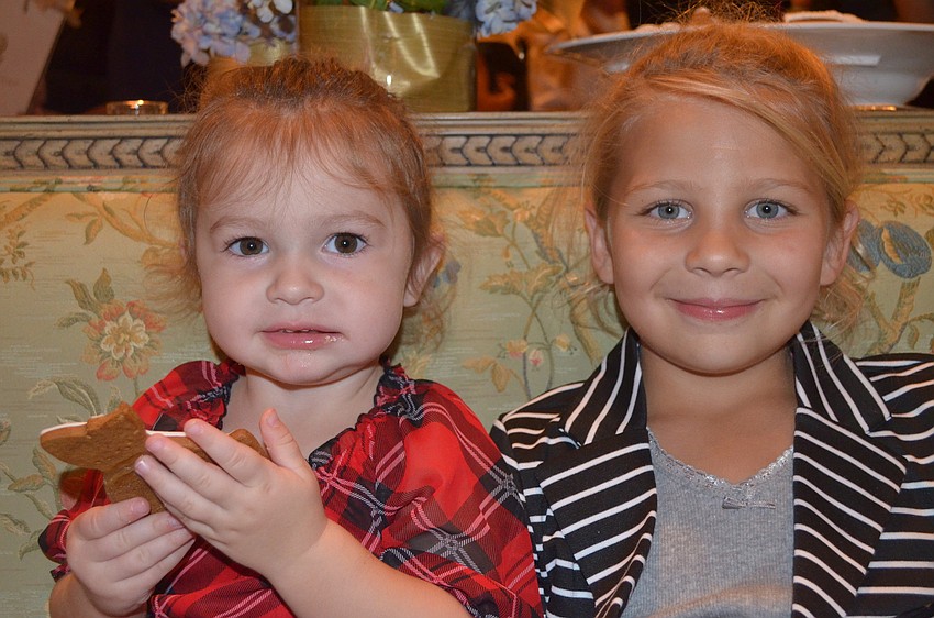 Holland and Cambelle Anders eat the ginger bread cookies