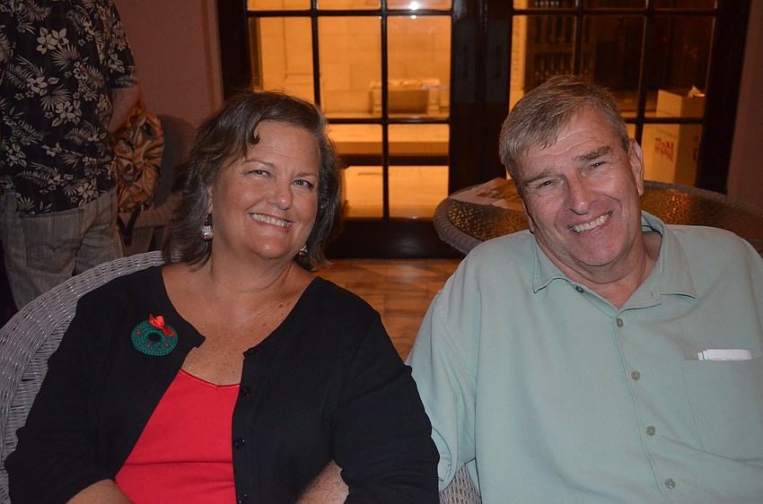 Mickey Botjer and Gary Mooers relax in the courtyard