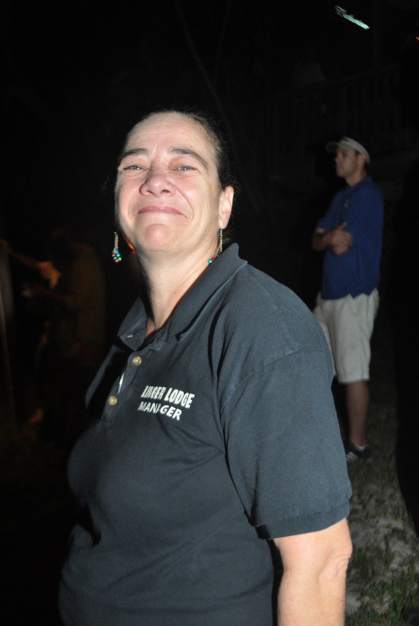 Linger Lodge restaurant manager Rita Lewis looks on.
