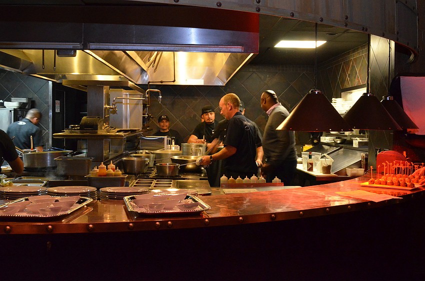 Celebrity chefs prepare their meals in the kitchen at Darwinâ€™s on 4th for the Celebrity Chef Tour Dinner Wednesday, Dec. 11.