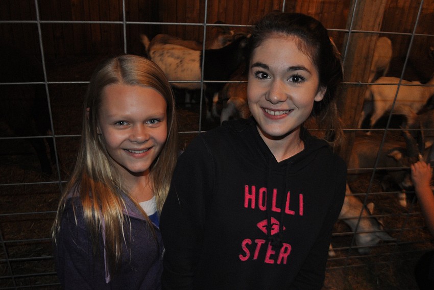 Caroline Kincaid and Mikayla Lemieux stop by the petting zoo.