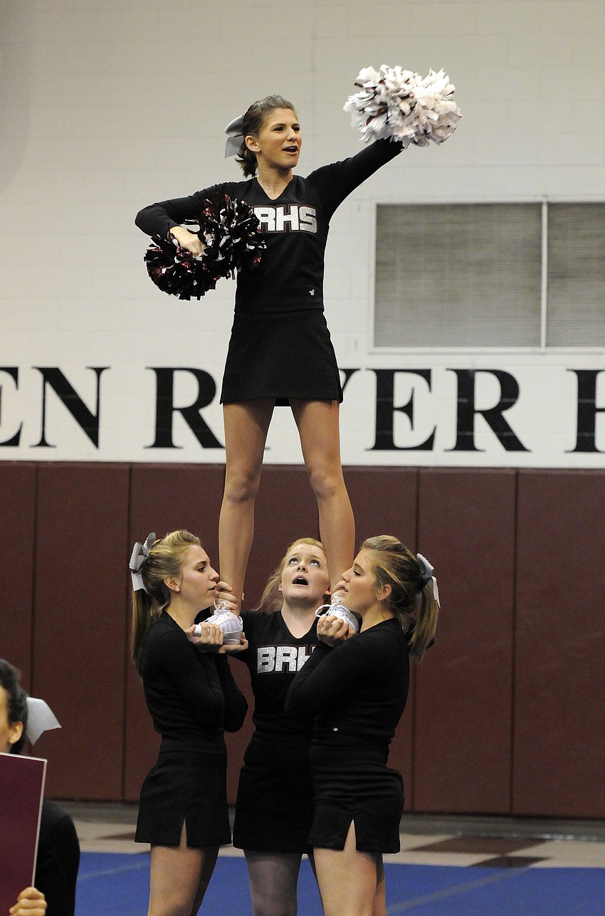 Braden River High freshman Allie McLelland leads the crowd in a cheer during the JV competition.