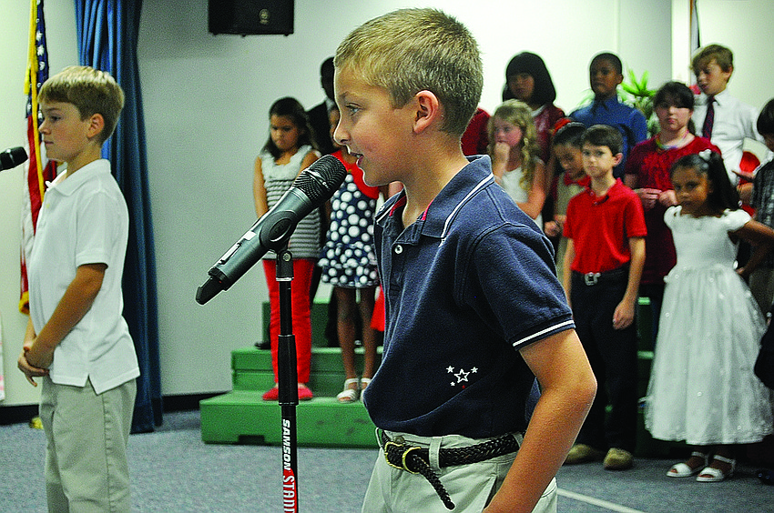 Curran McDerment performs patriotic songs Nov. 19 at Bashaw Elementary School, in recognition of American Education Week.