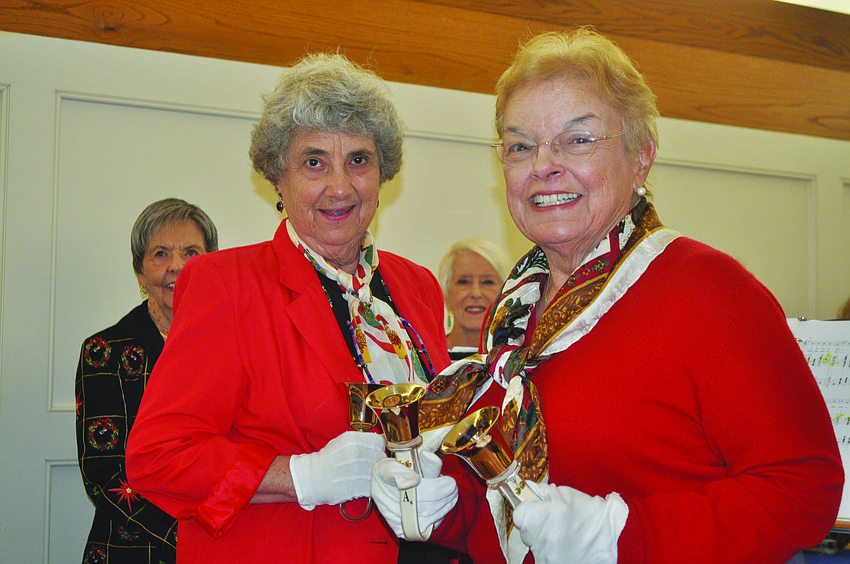 Mary Gobell and Joan Colwell ring in the new year at the Jan. 4 All Angels by the Sea Episcopal Church annual Epiphany concert.