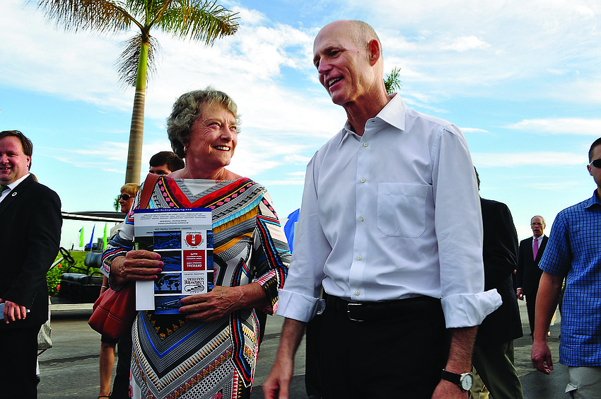 Sen. Nancy Detert walks with Gov. Rick Scott as he tours Nathan Benderson park Aug. 15, when the venue hosted the USRowing Masters National Championships.
