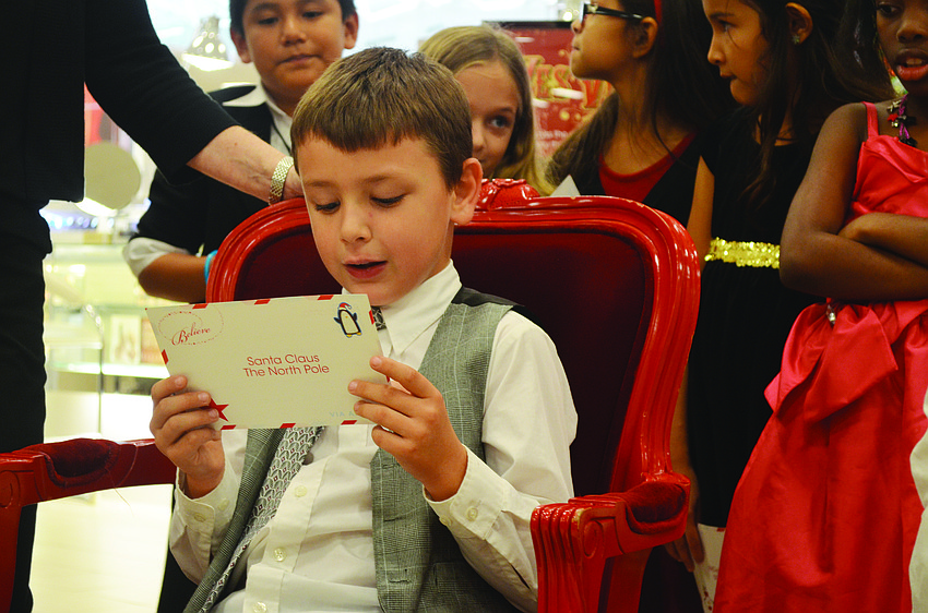 On Dec. 6 Ashton Bentley reads the letter he wrote to Santa before dropping it in the mailbox at Macy's. Macy's invited children from the Suncoast School for Innovative Studies to read their letters before it sent them to the North Pole.