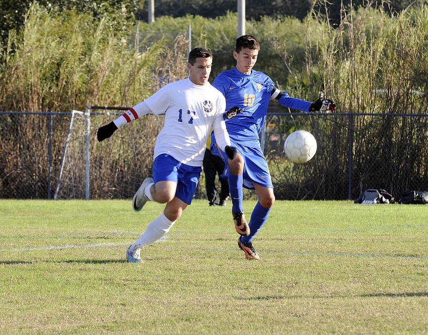 SMAâ€™s Stephen Payne and Sarasota Christianâ€™s Justis Mejia-Slattery battle for possession in the first half.