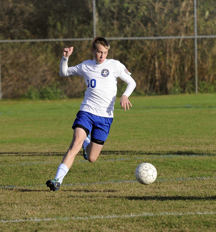 Sarasota Military Academyâ€™s Connor Long controls the ball in the midfield for the Eagles.