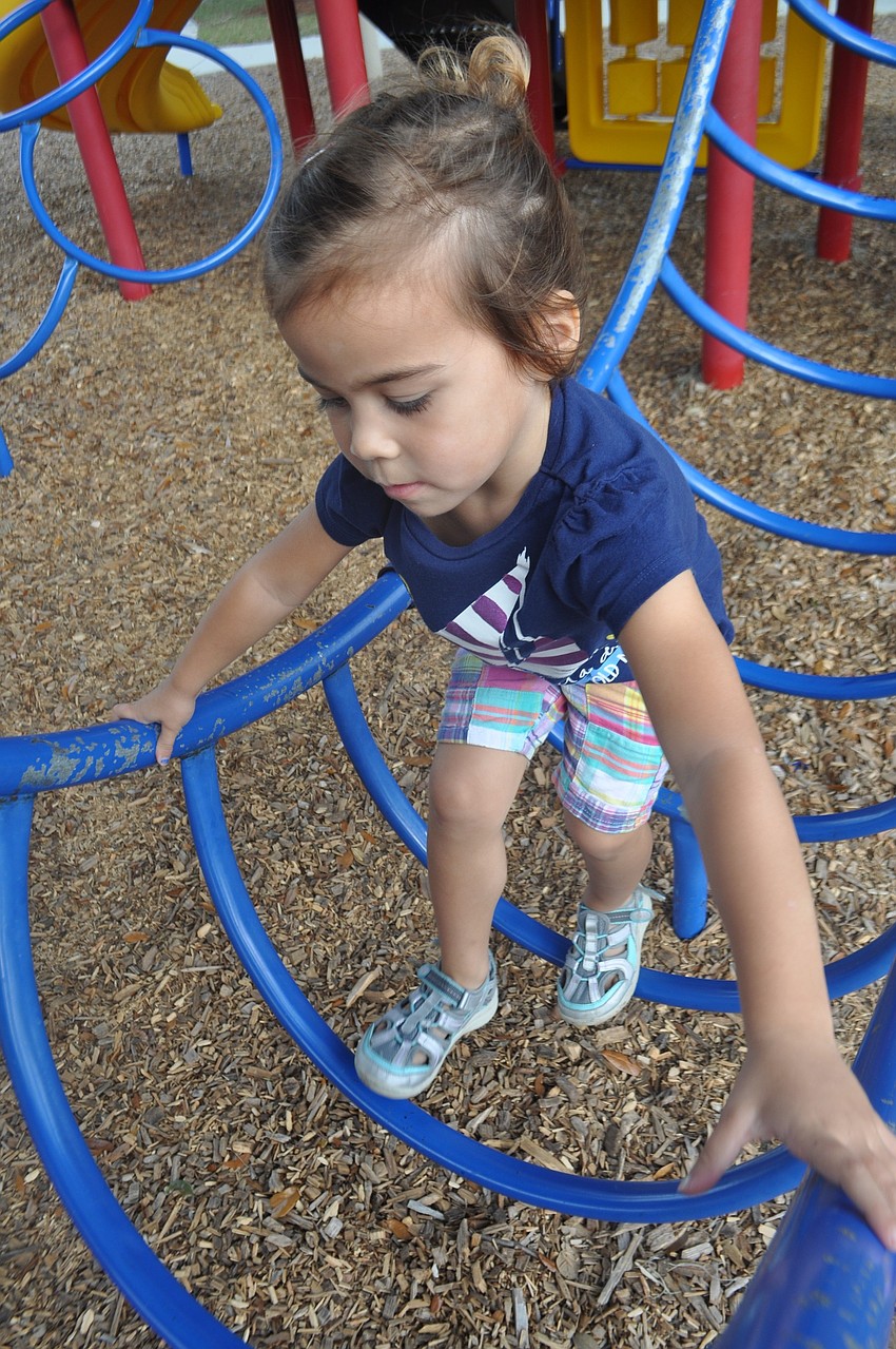 Avery Stewart, 3, spends time on the playground.