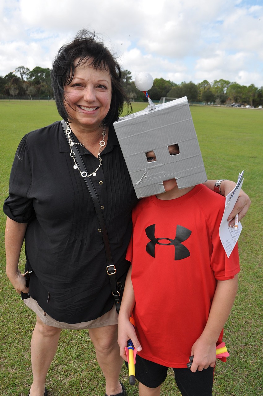 Robin McCormick gave up a box so her grandson, Sullivan Maley, 9, could make a robot head.